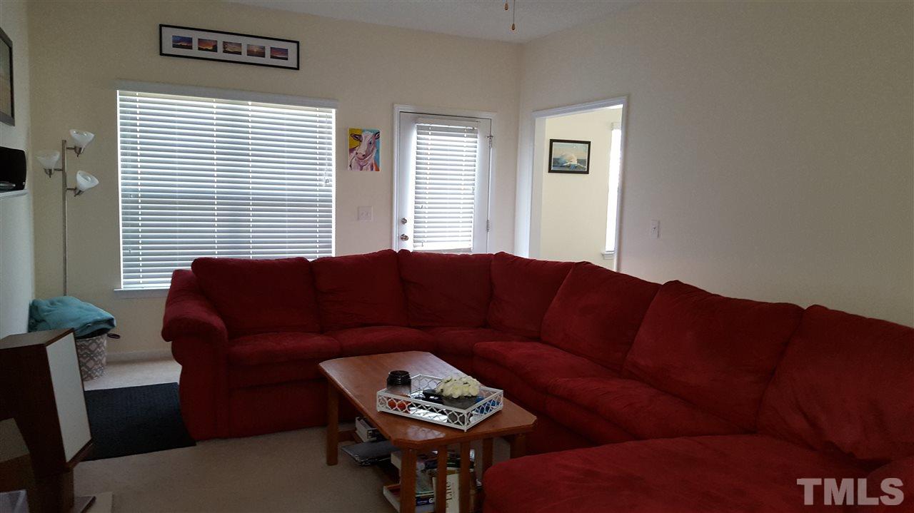 4806 Kitledge Drive Raleigh, NC 27610 - Photo 7 of 24 a living room with furniture and a window