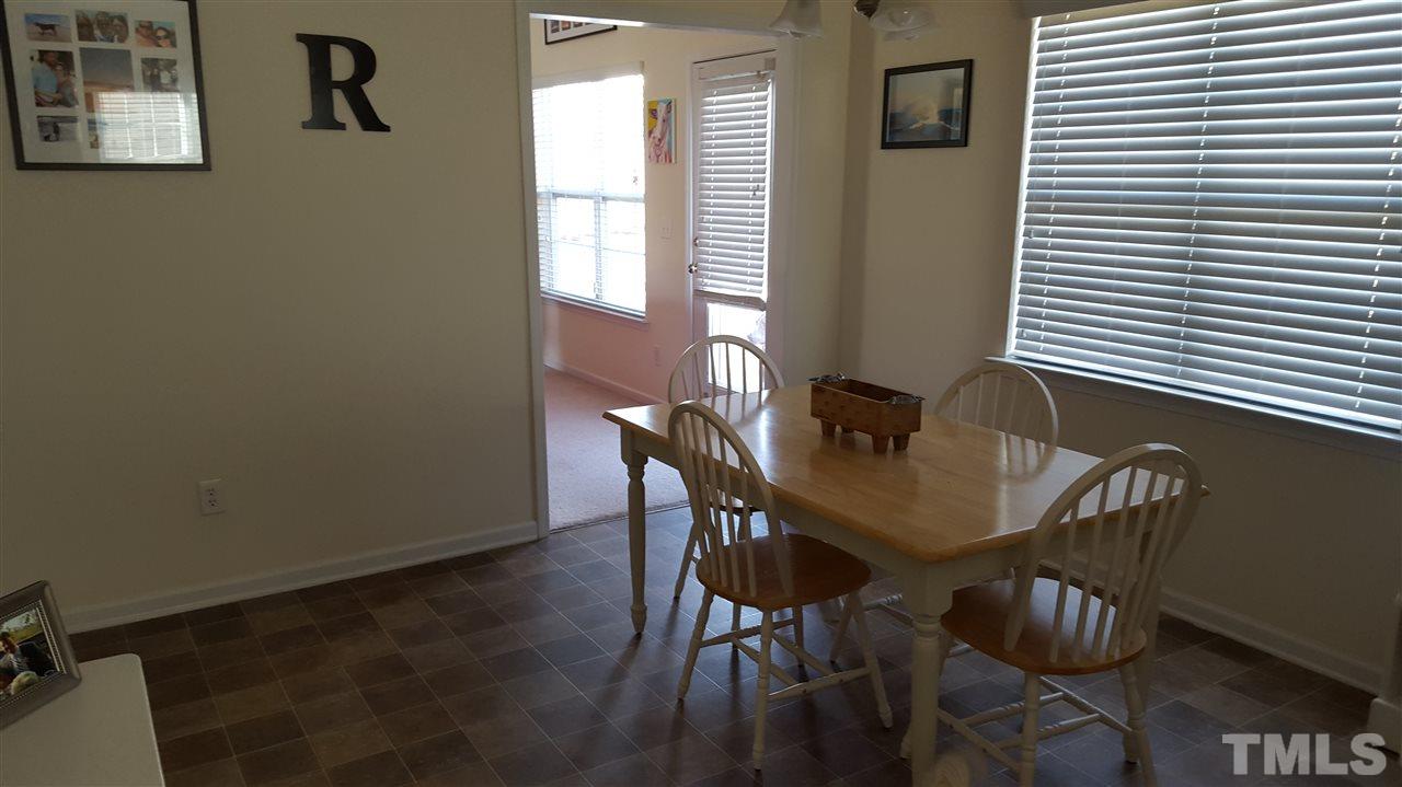 4806 Kitledge Drive Raleigh, NC 27610 - Photo 10 of 24 a view of a dining room with furniture and window