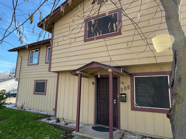 a front view of a house with a garage
