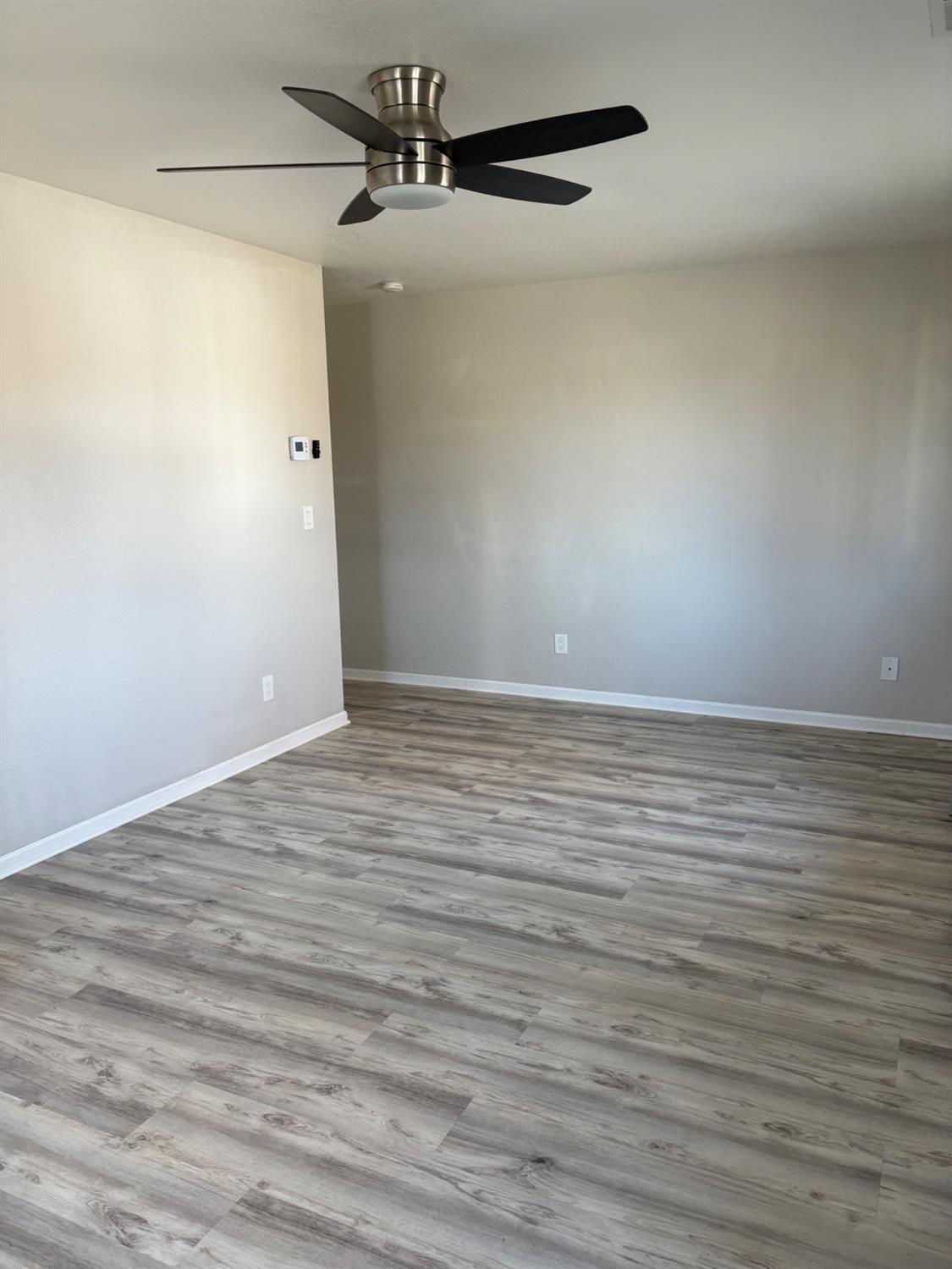 206 West 12th Street Tracy, CA 95376 - Photo 9 of 17 wooden floor in a empty room