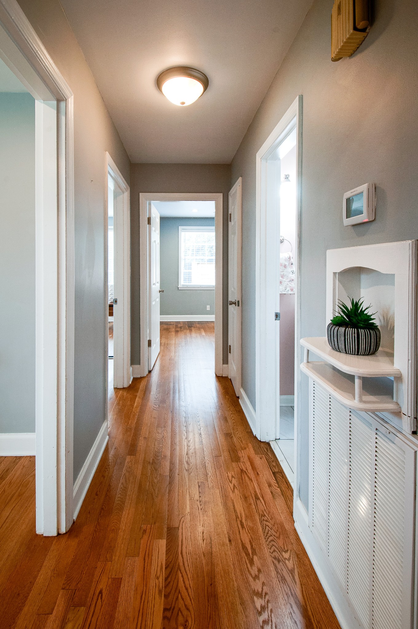 918 Mitchell Road Nashville, TN 37206 - Photo 19 of 34 a view of a hallway with wooden floor