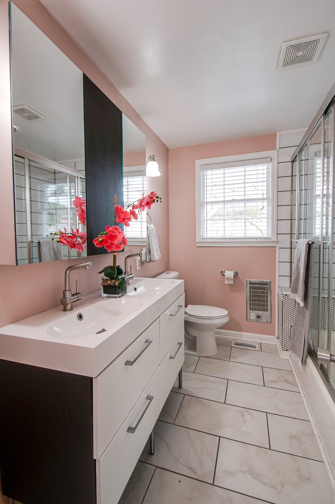 918 Mitchell Road Nashville, TN 37206 - Photo 21 of 34 a bathroom with a double vanity sink mirror and toilet