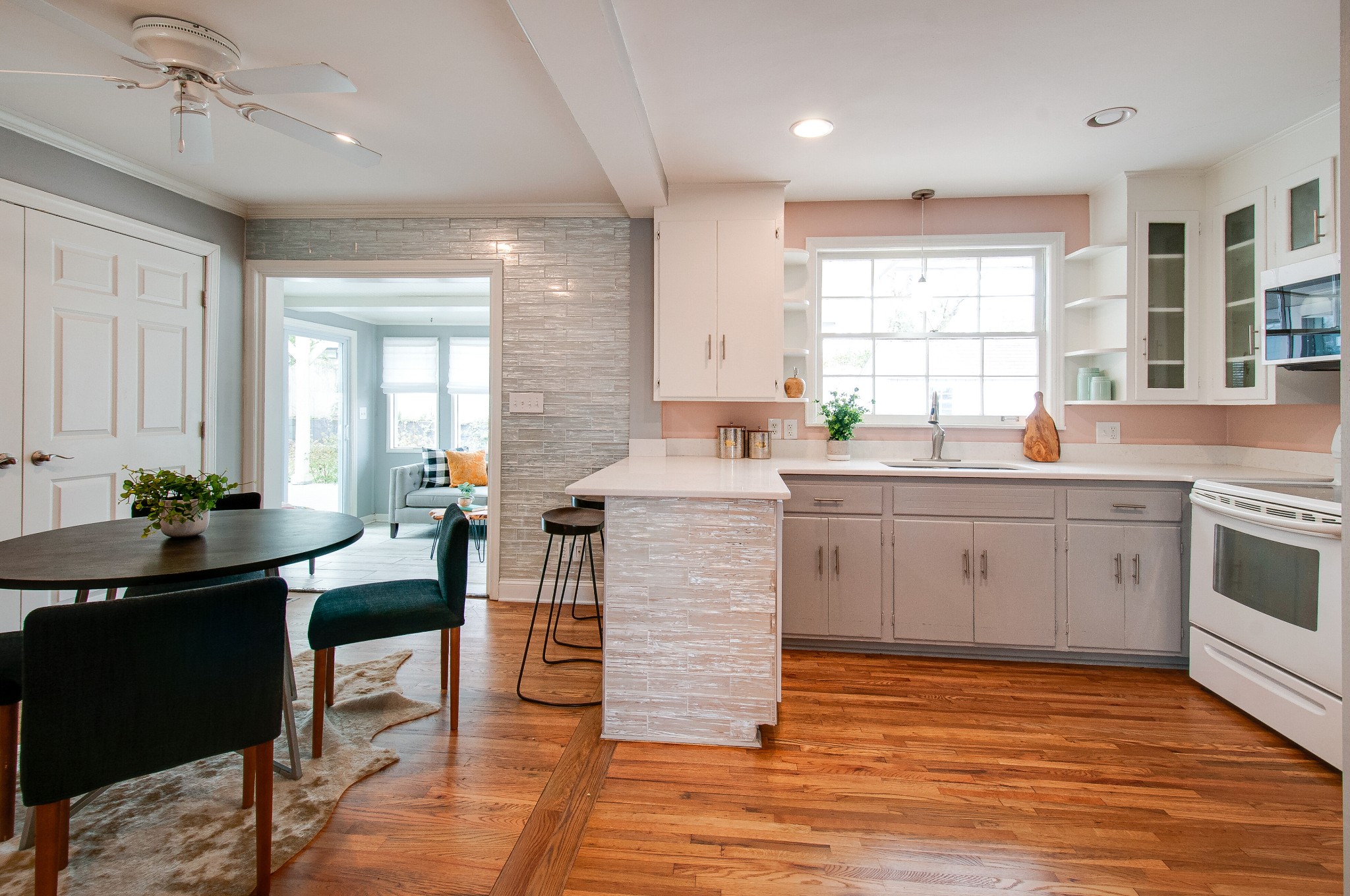 918 Mitchell Road Nashville, TN 37206 - Photo 8 of 34 a kitchen with a sink stove cabinets and wooden floor