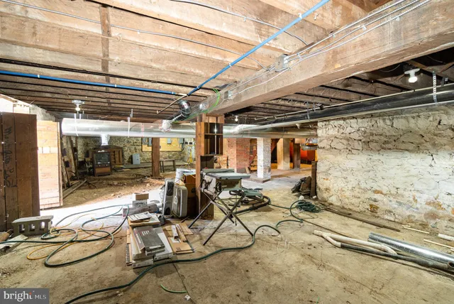 a view of a yard with wooden fence