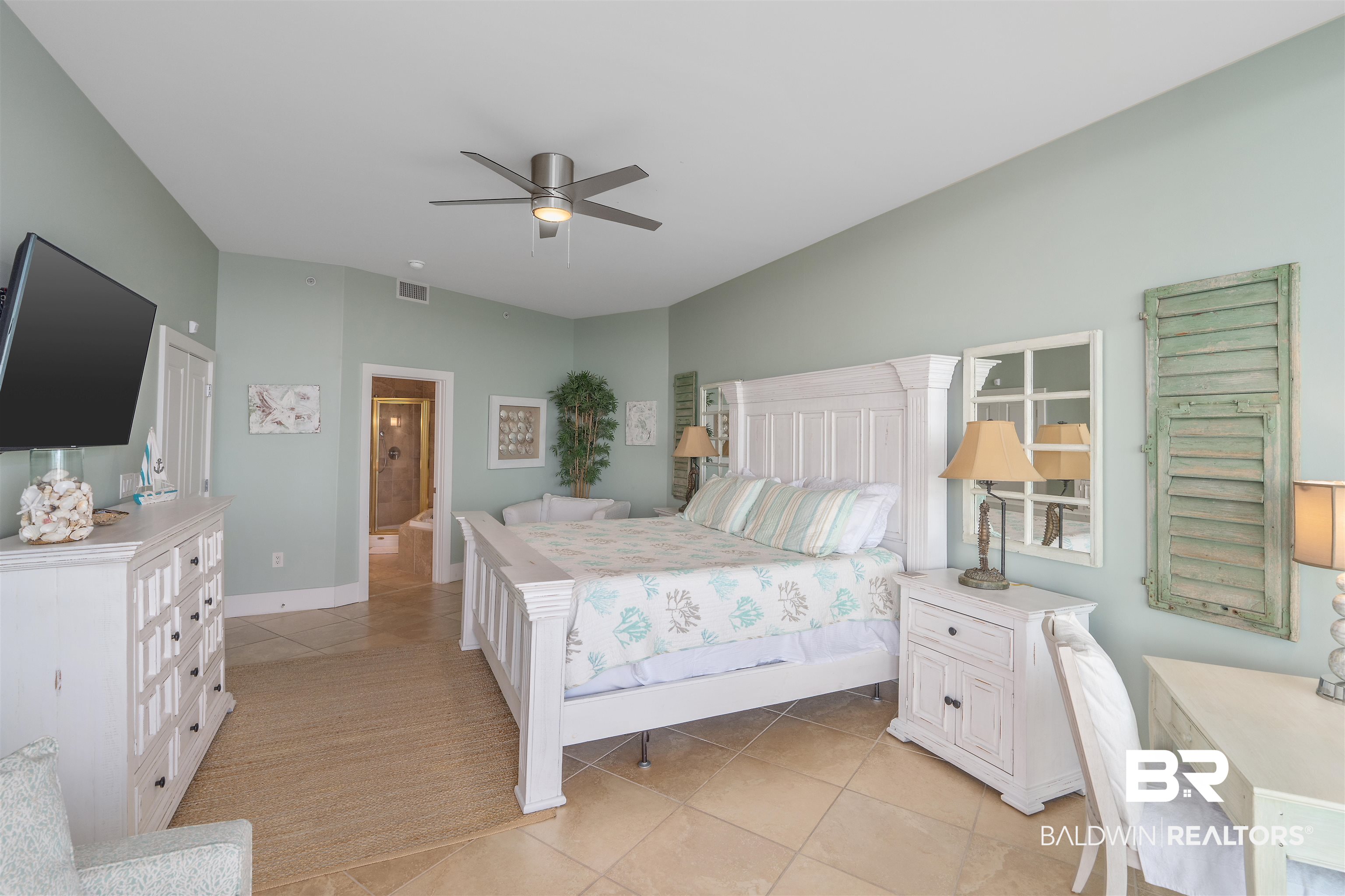 28107 Perdido Beach Boulevard, Unit DPH06 Orange Beach, AL 36561 - Photo 13 of 70 Bedroom featuring ceiling fan, connected bathroom, and light tile patterned floors