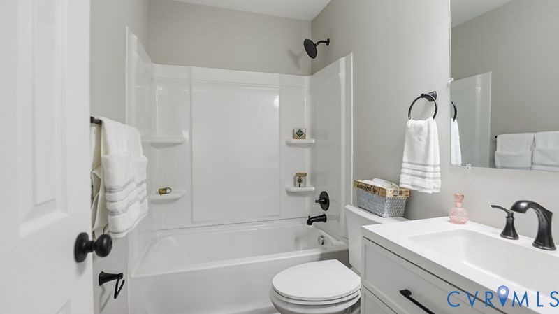 25209 Ritchie Avenue Petersburg, VA 23803 - Photo 32 of 50 a bathroom with a toilet a sink and a bathtub
