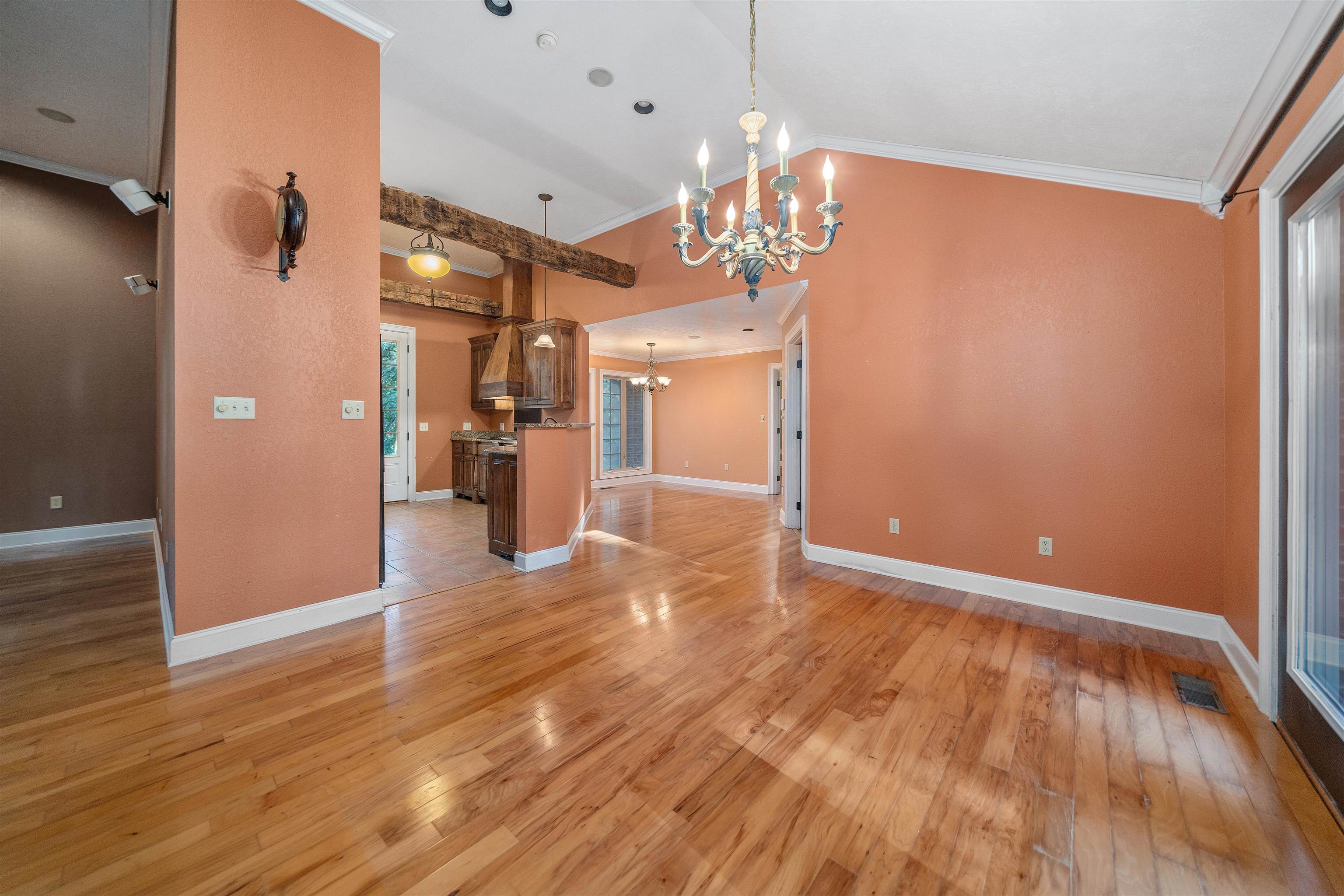 31 Timber Lane Selmer, TN 38375 - Photo 17 of 29 a view of a big room with wooden floor and chandelier