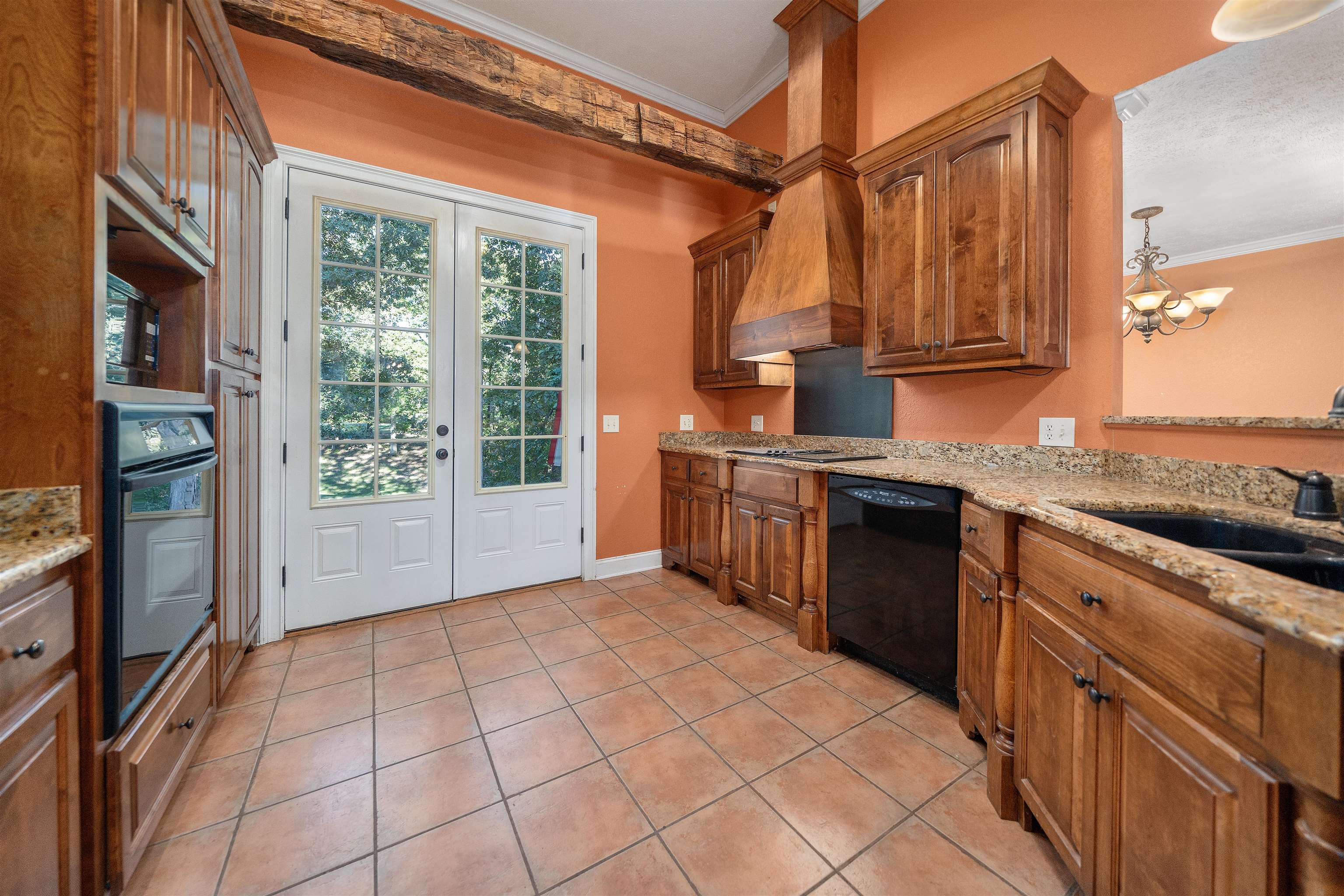 31 Timber Lane Selmer, TN 38375 - Photo 20 of 29 a kitchen with stainless steel appliances granite countertop a refrigerator a stove and a sink with wooden cabinets