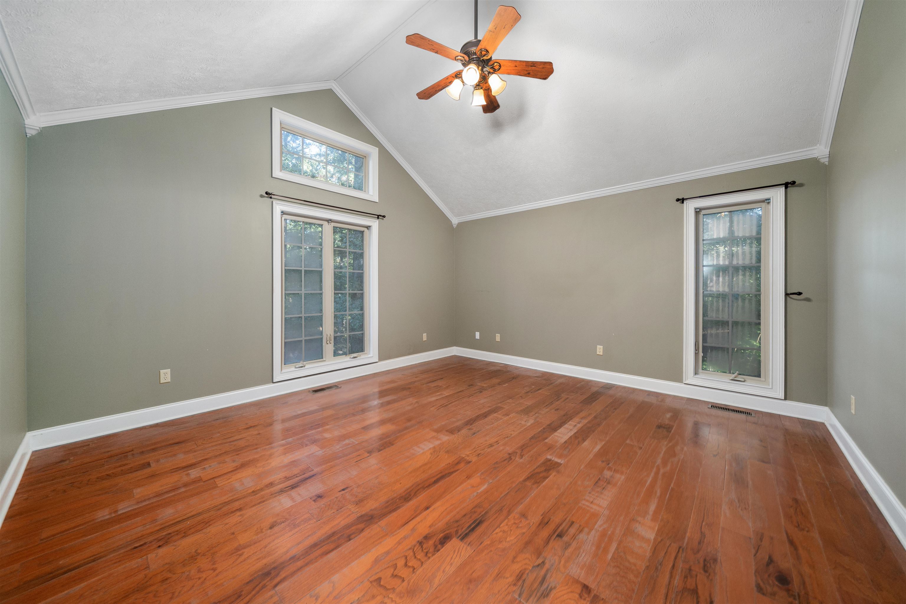31 Timber Lane Selmer, TN 38375 - Photo 23 of 29 a view of an empty room with a window and wooden floor