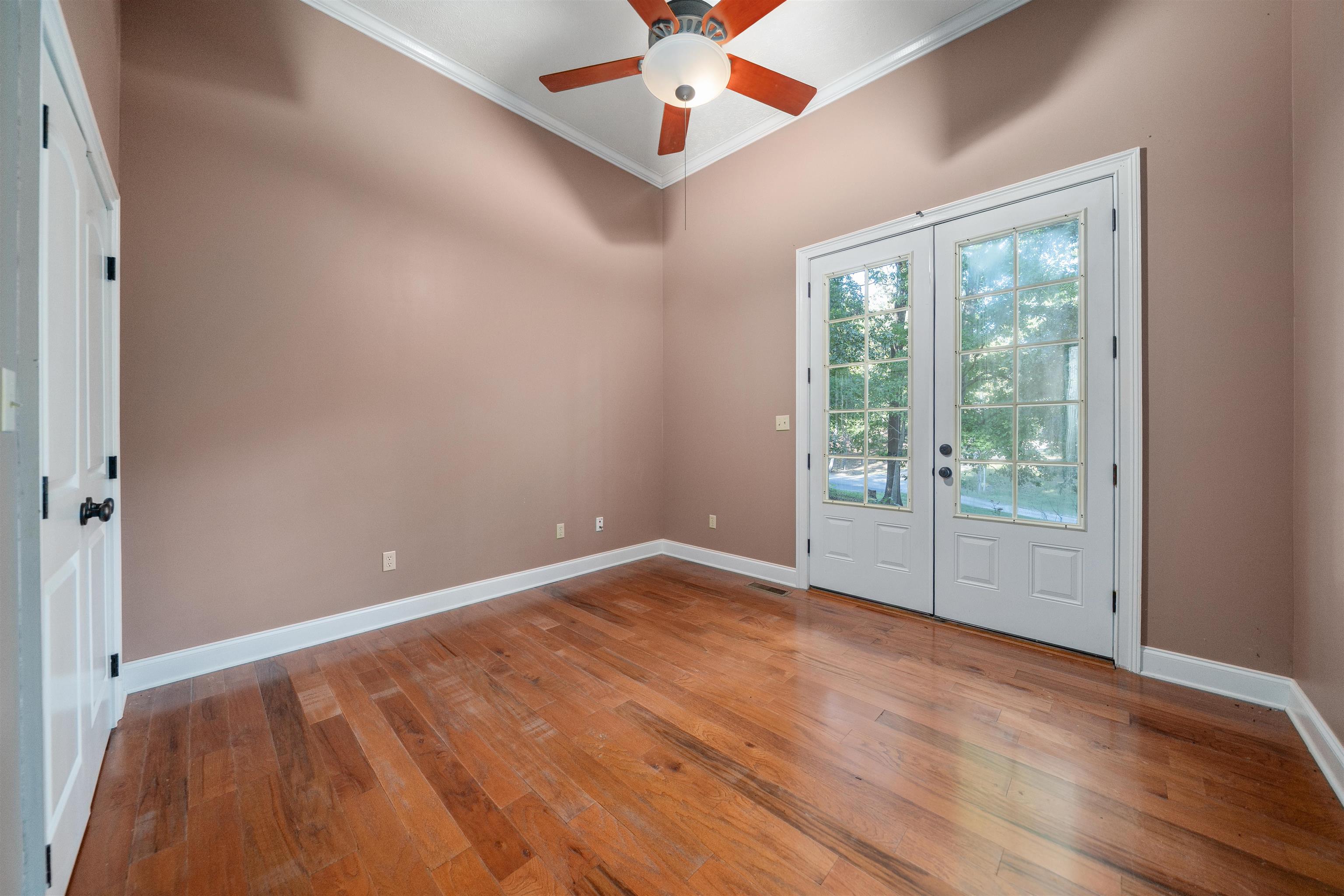 31 Timber Lane Selmer, TN 38375 - Photo 27 of 29 a view of an empty room with window and wooden floor
