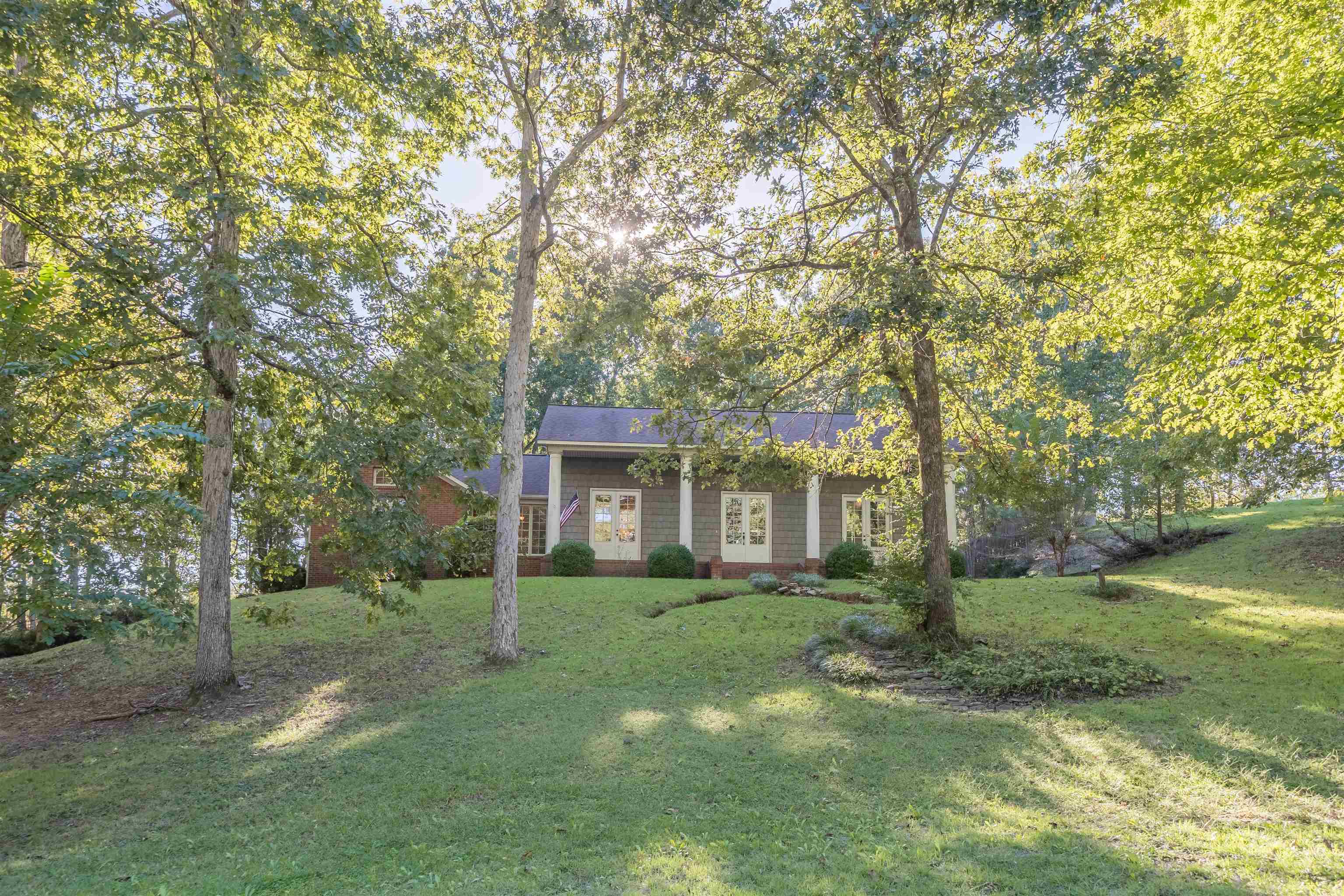 31 Timber Lane Selmer, TN 38375 - Photo 3 of 29 front view of a house with a yard