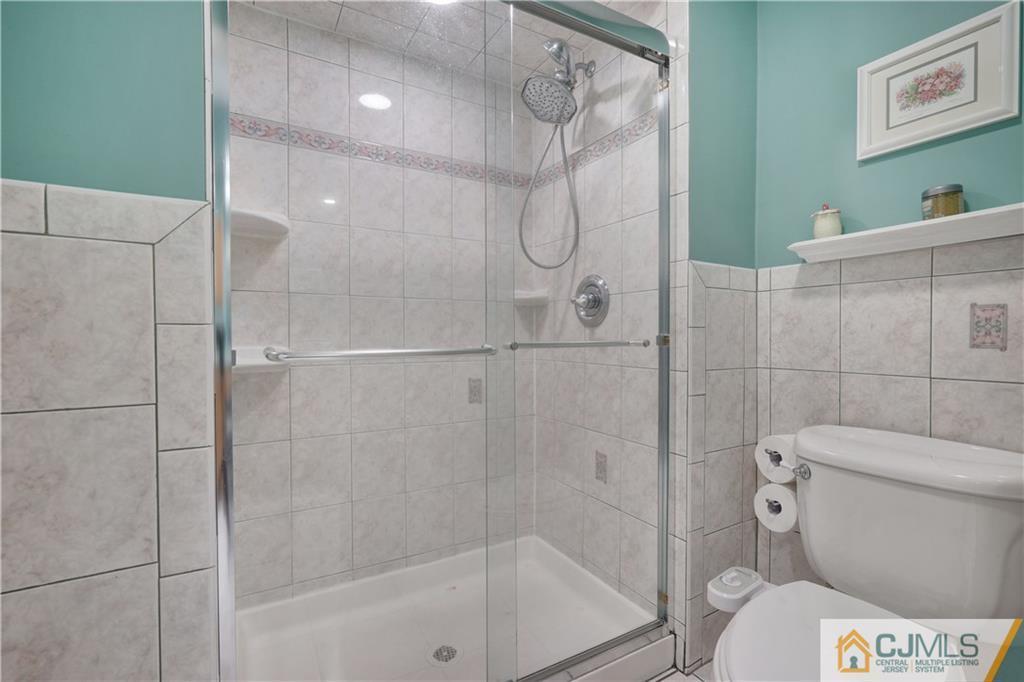 A11 Georges Road Dayton, NJ 08810 - Photo 23 of 25 a bathroom with a shower a toilet and a shower