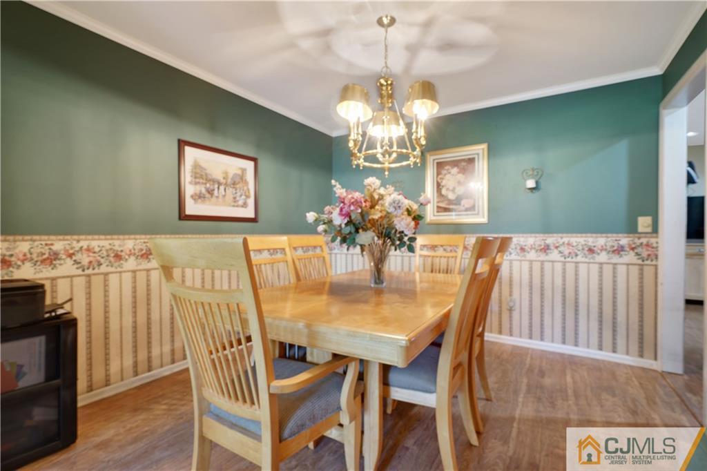 A11 Georges Road Dayton, NJ 08810 - Photo 8 of 25 a view of a dining room with furniture and chandelier