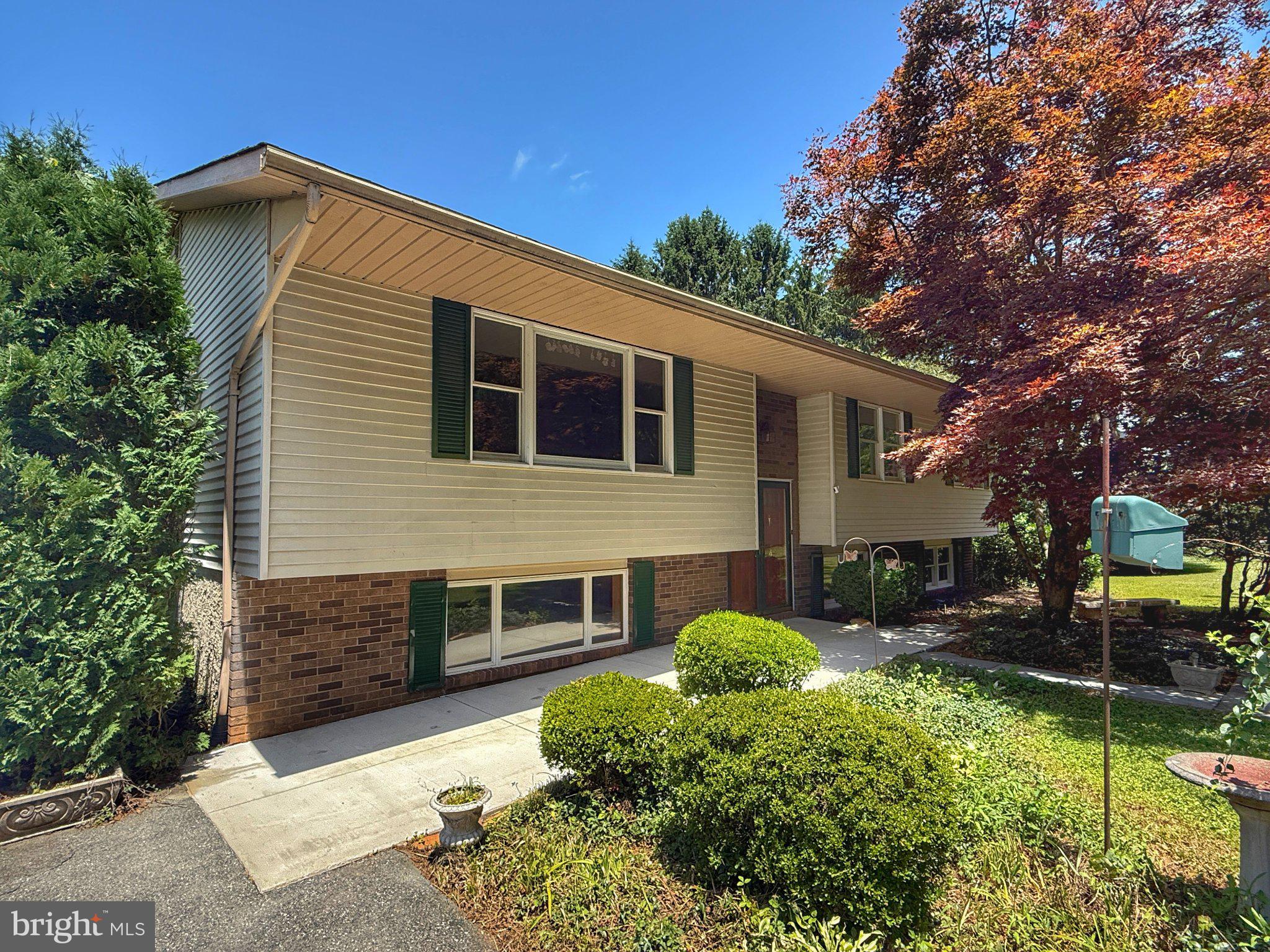 4 Martz Road Sykesville, MD 21784 - Photo 1 of 12 a front view of a house with garden