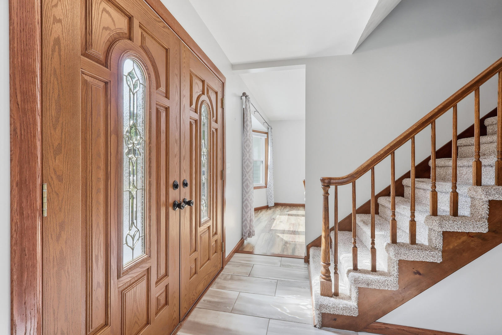 4314 Spring Street Davenport, IA 52807 - Photo 6 of 51 a view of an entryway with wooden floor and stairs
