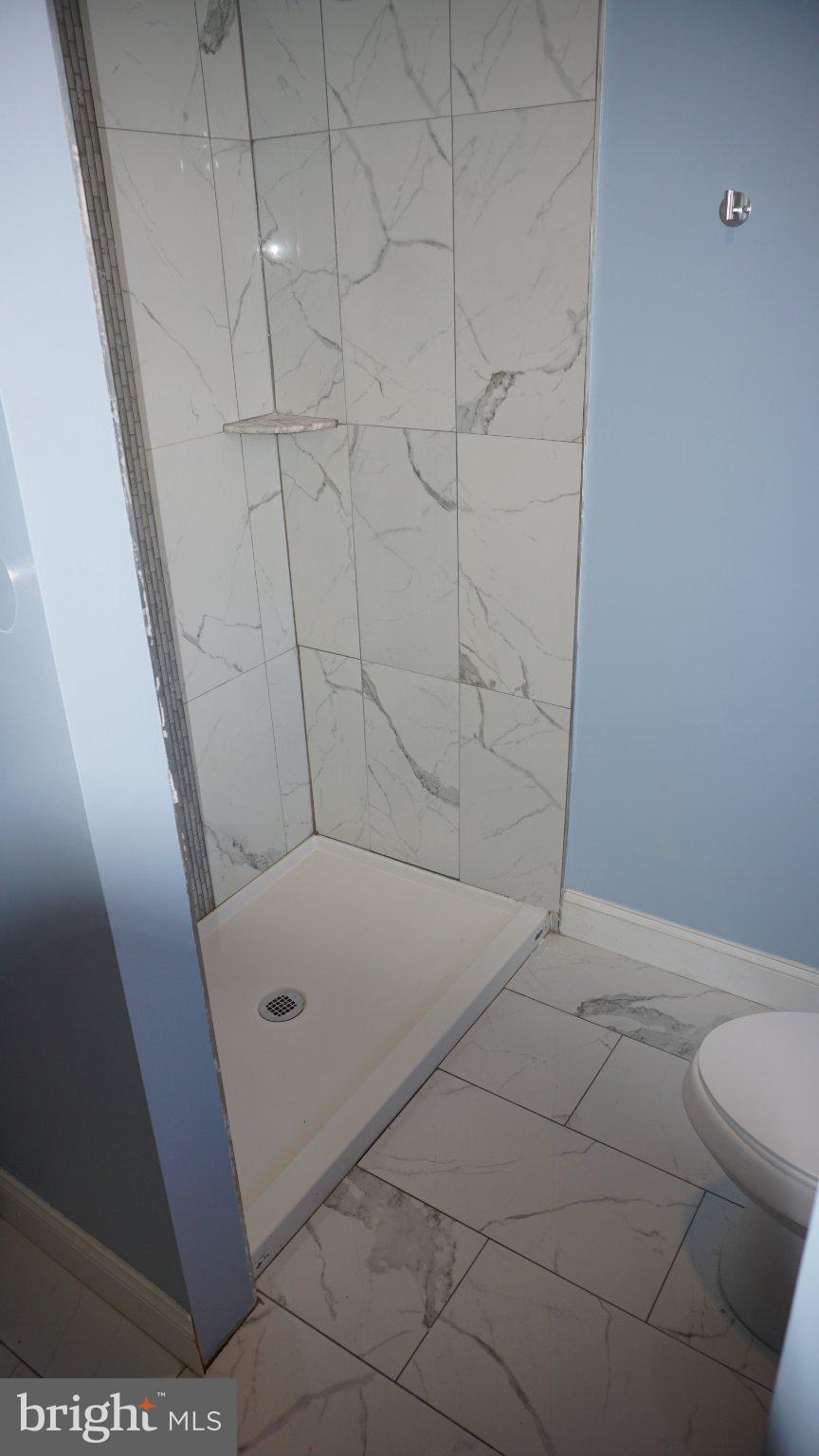5854 Deale Churchton Road Deale, MD 20751 - Photo 26 of 57 Sleek shower with elegant tiles.