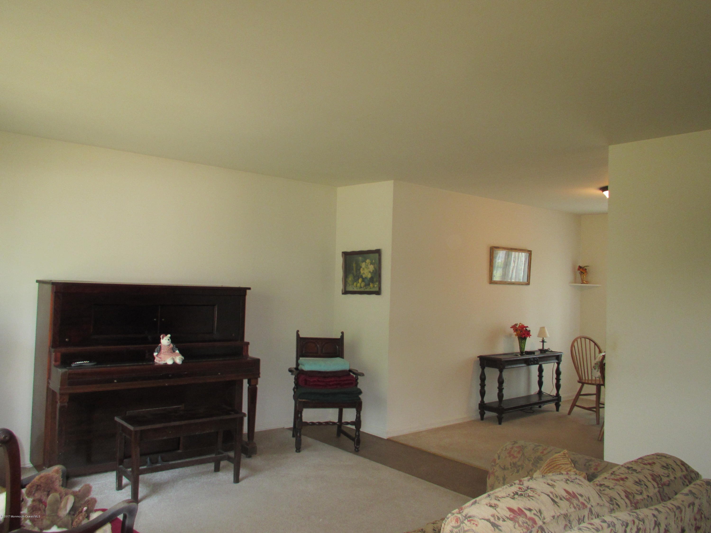 59 Korman Road Bayville, NJ 08721 - Photo 7 of 20 a living room with furniture a piano and a window
