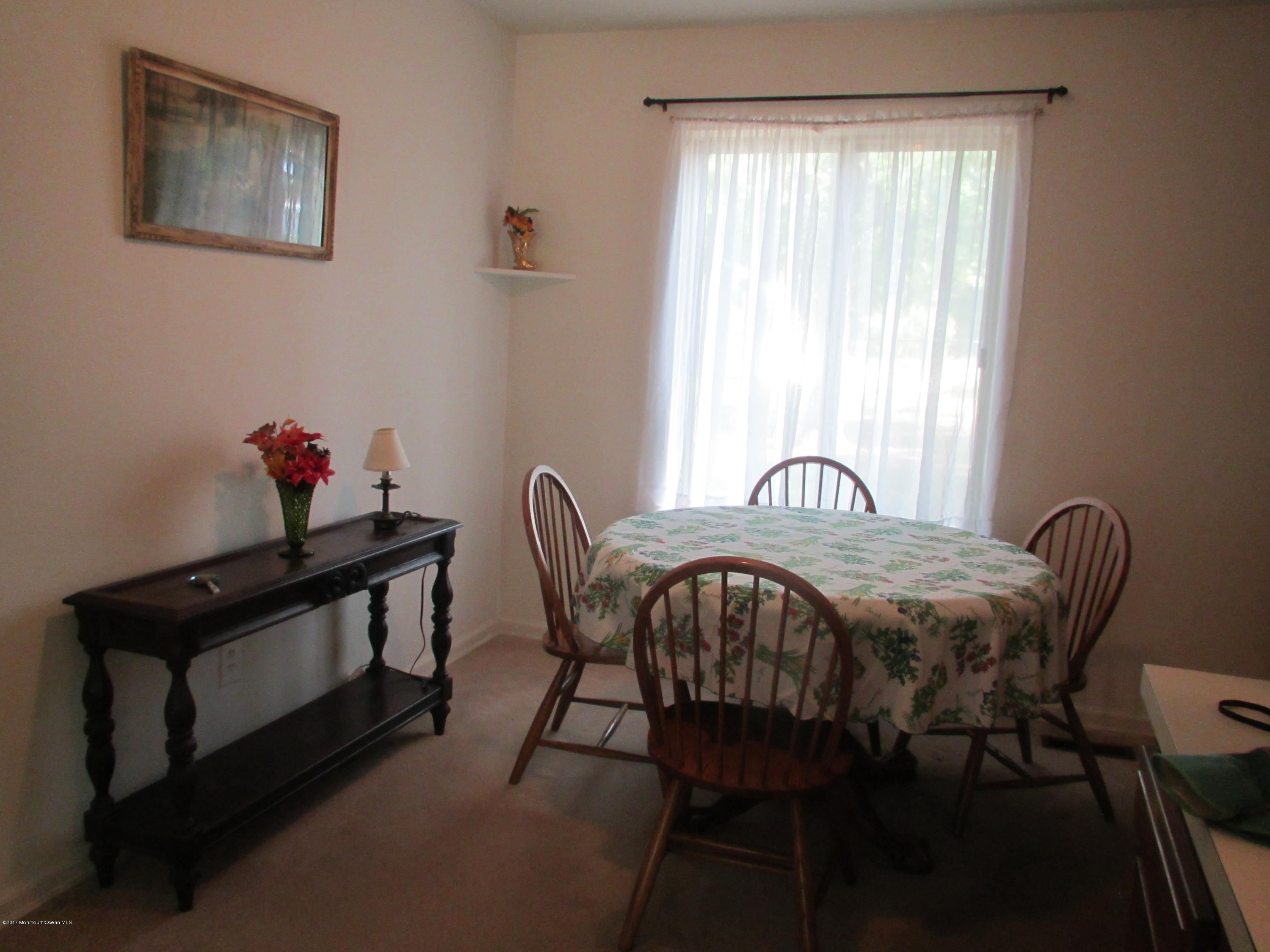 59 Korman Road Bayville, NJ 08721 - Photo 8 of 20 a view of a dining room with furniture and a window