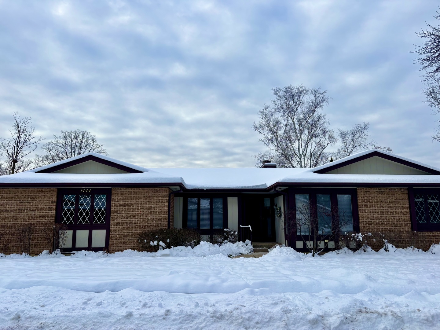 1444 Estate Lane Glenview, IL 60025 - Photo 1 of 1 a front view of a house with yard and seating space