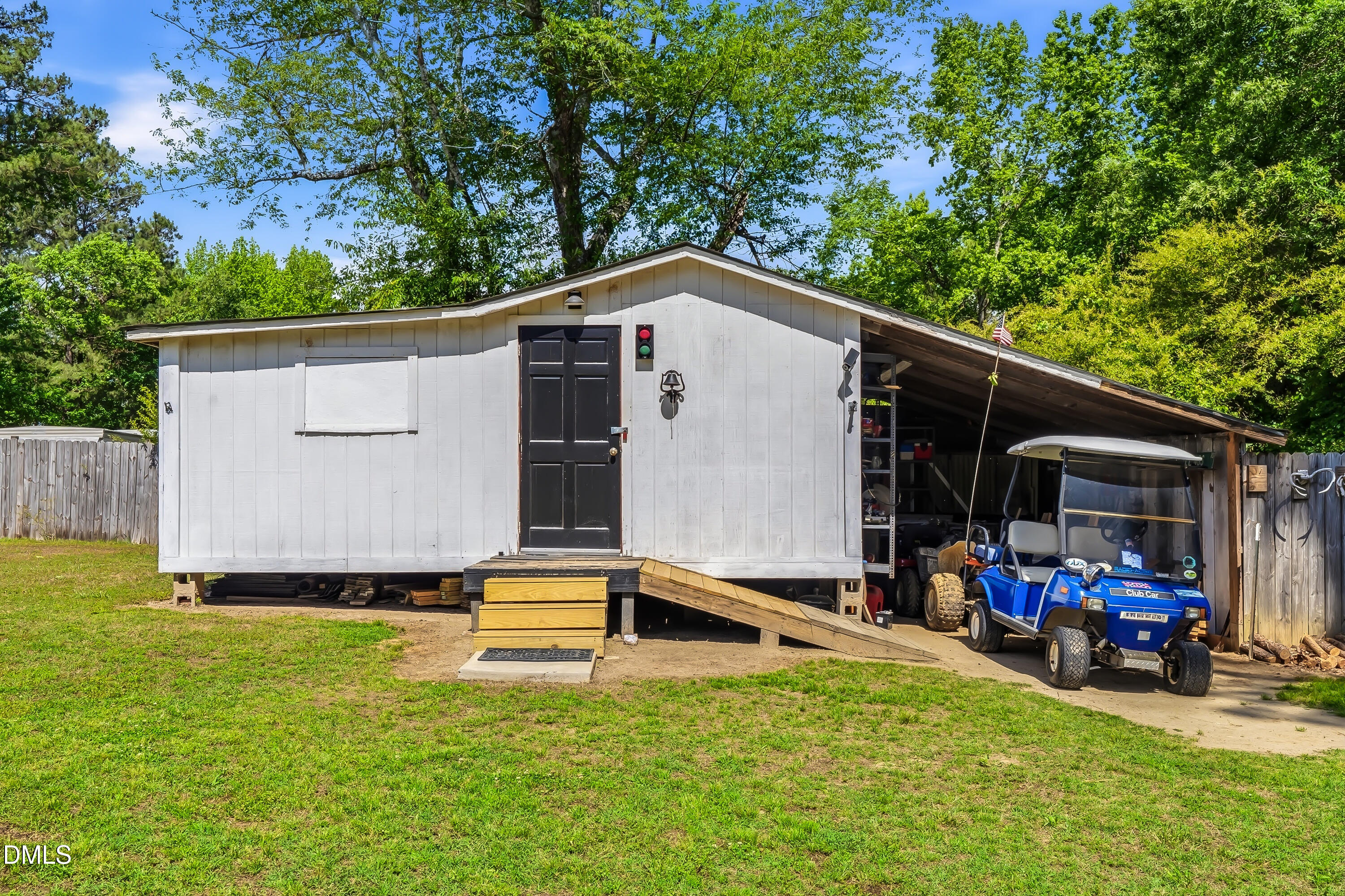 4967 Highway 581 Spring Hope, NC 27882 - Photo 14 of 44 a front view of a house with garden