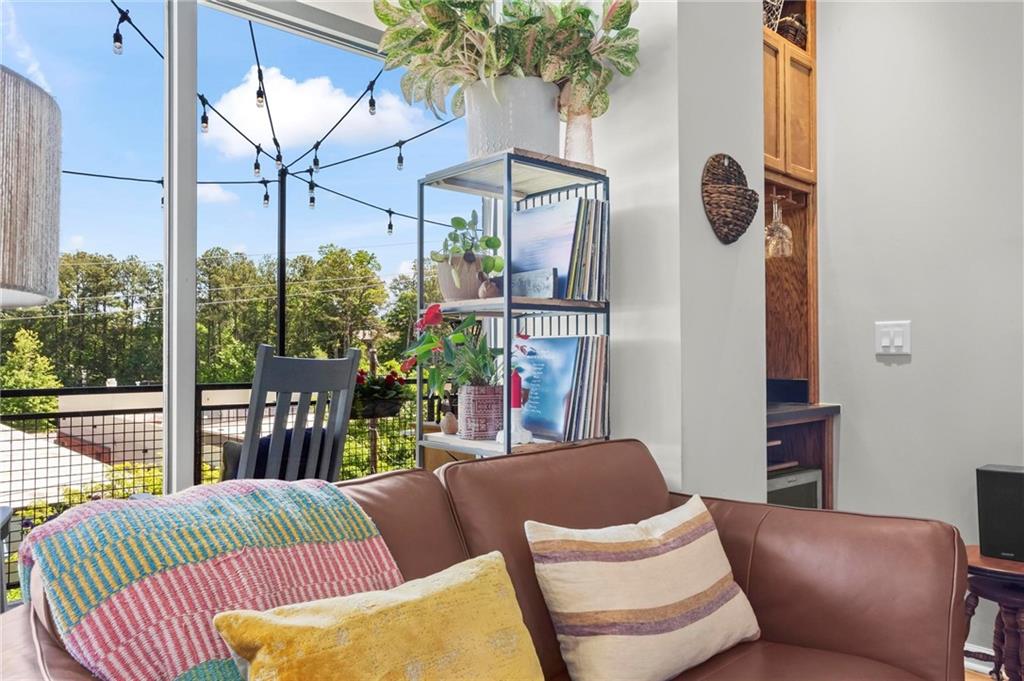 3400 Malone Drive, Unit 219 Atlanta, GA 30341 - Photo 12 of 60 a view of a patio with couches table and chairs and potted plants