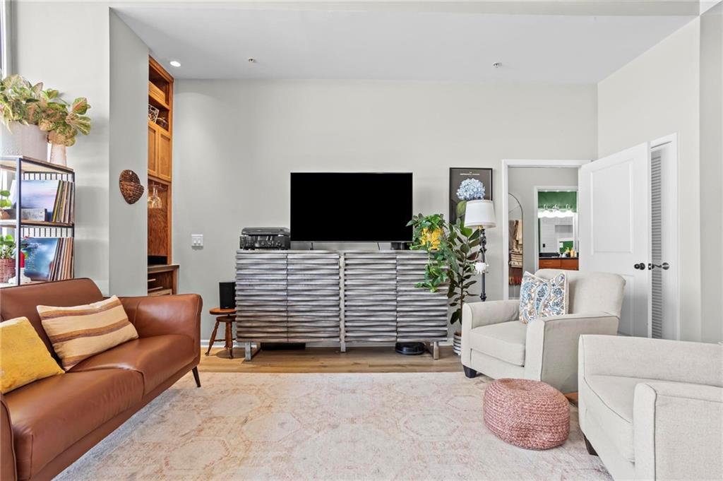 3400 Malone Drive, Unit 219 Atlanta, GA 30341 - Photo 13 of 60 a living room with furniture and a flat screen tv