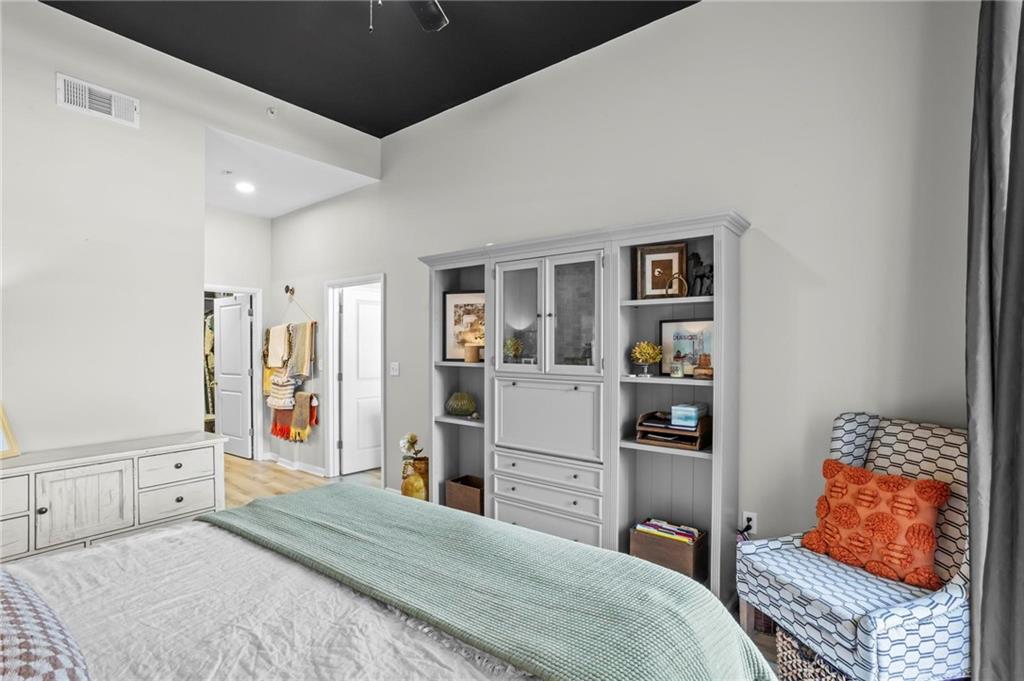 3400 Malone Drive, Unit 219 Atlanta, GA 30341 - Photo 23 of 60 a bedroom with a bed cabinets and window