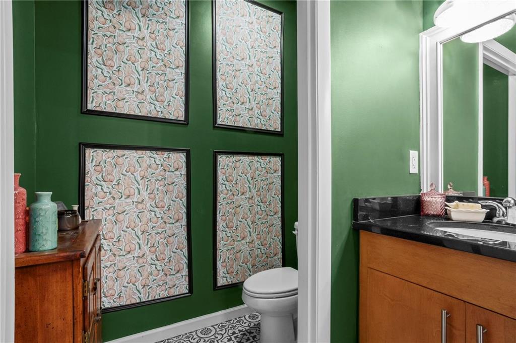 3400 Malone Drive, Unit 219 Atlanta, GA 30341 - Photo 30 of 60 a bathroom with a toilet sink and mirror