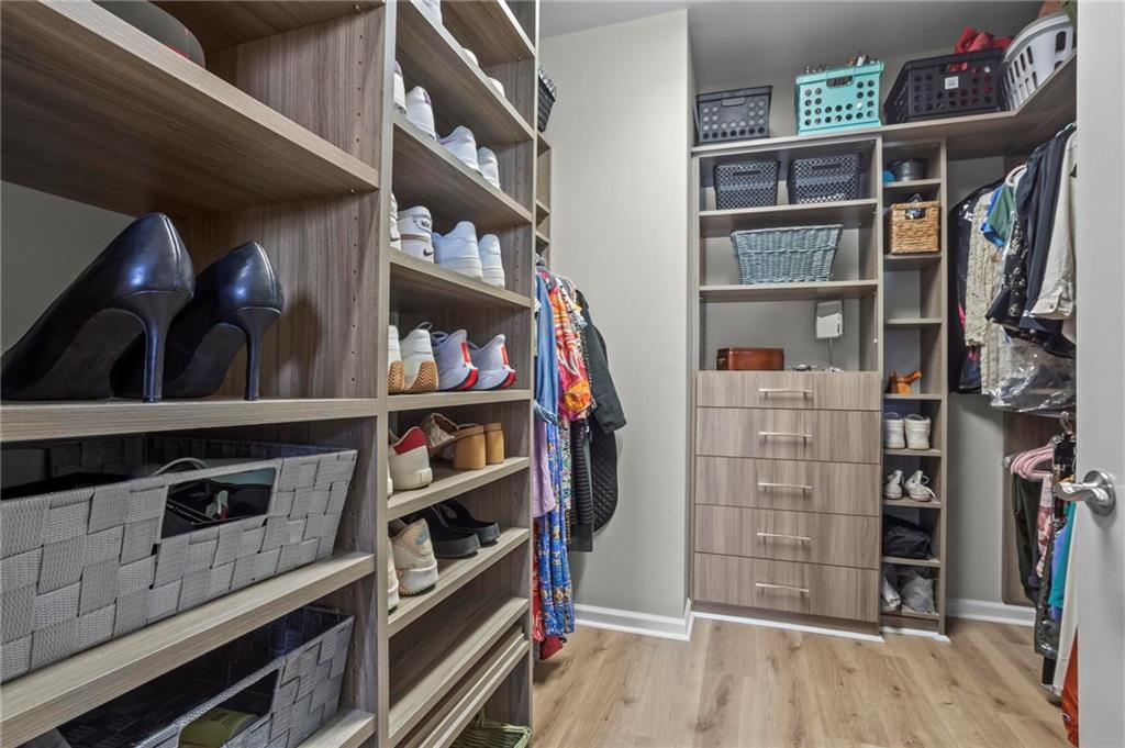 3400 Malone Drive, Unit 219 Atlanta, GA 30341 - Photo 32 of 60 a view of walk in closet with clothes and shoes