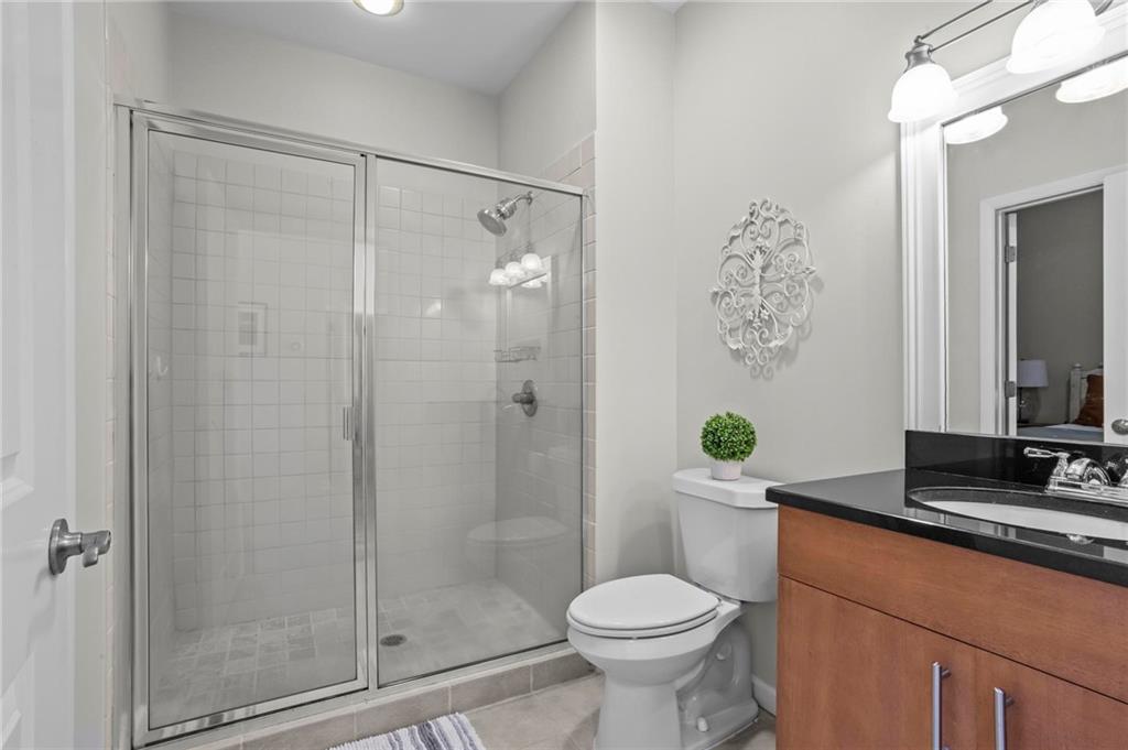 3400 Malone Drive, Unit 219 Atlanta, GA 30341 - Photo 35 of 60 a bathroom with a granite countertop sink toilet and shower