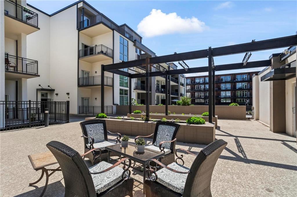 3400 Malone Drive, Unit 219 Atlanta, GA 30341 - Photo 46 of 60 a view of a patio with couches table and chairs and potted plants