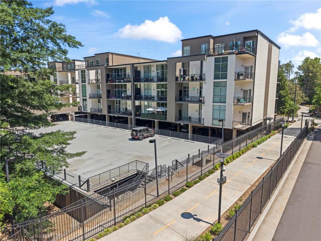 3400 Malone Drive, Unit 219 Atlanta, GA 30341 - Photo 48 of 60 a view of a balcony with chairs and iron fence
