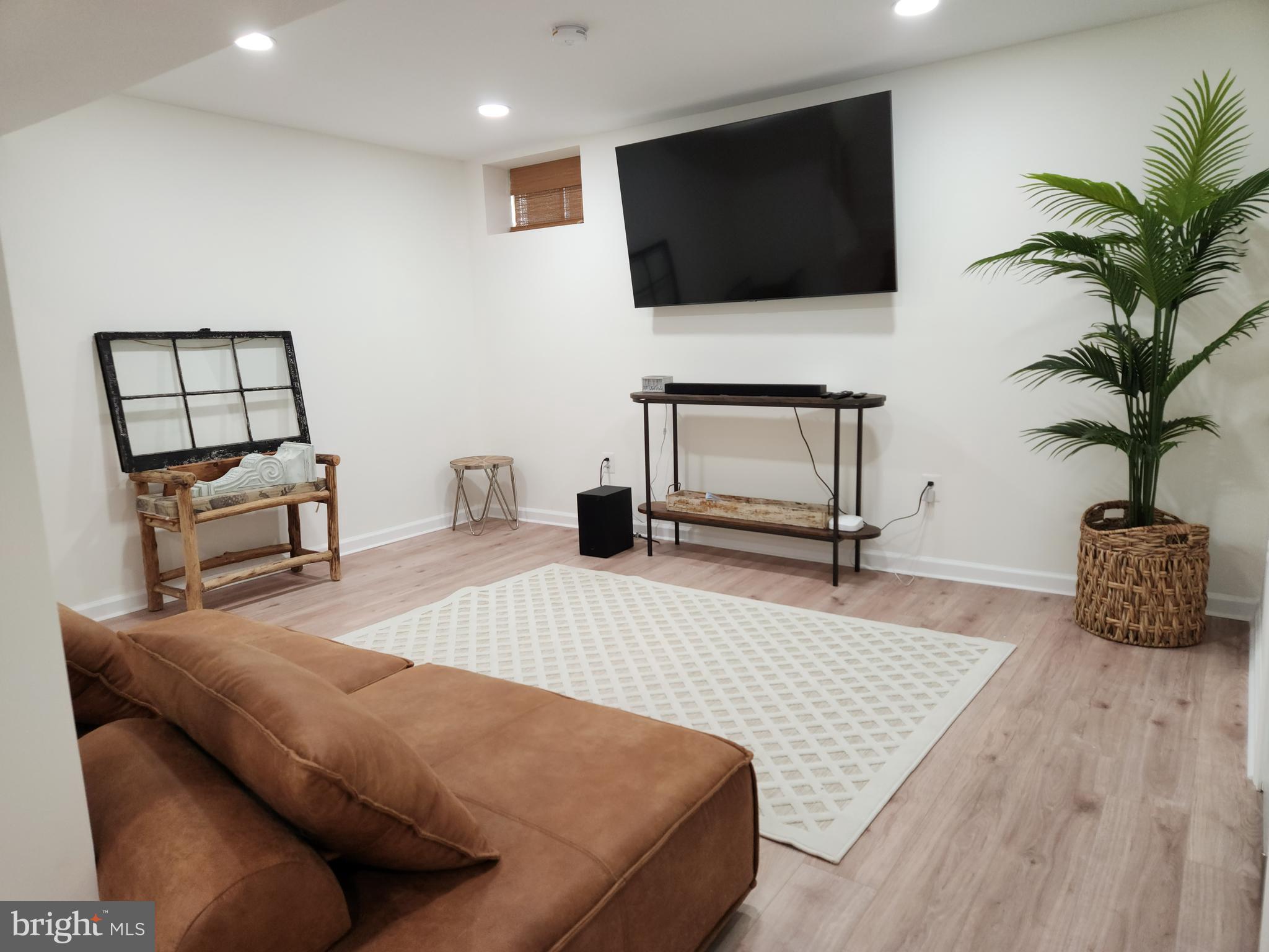 1203 Conewago Drive Frederick, MD 21702 - Photo 11 of 24 a living room with furniture and a flat screen tv