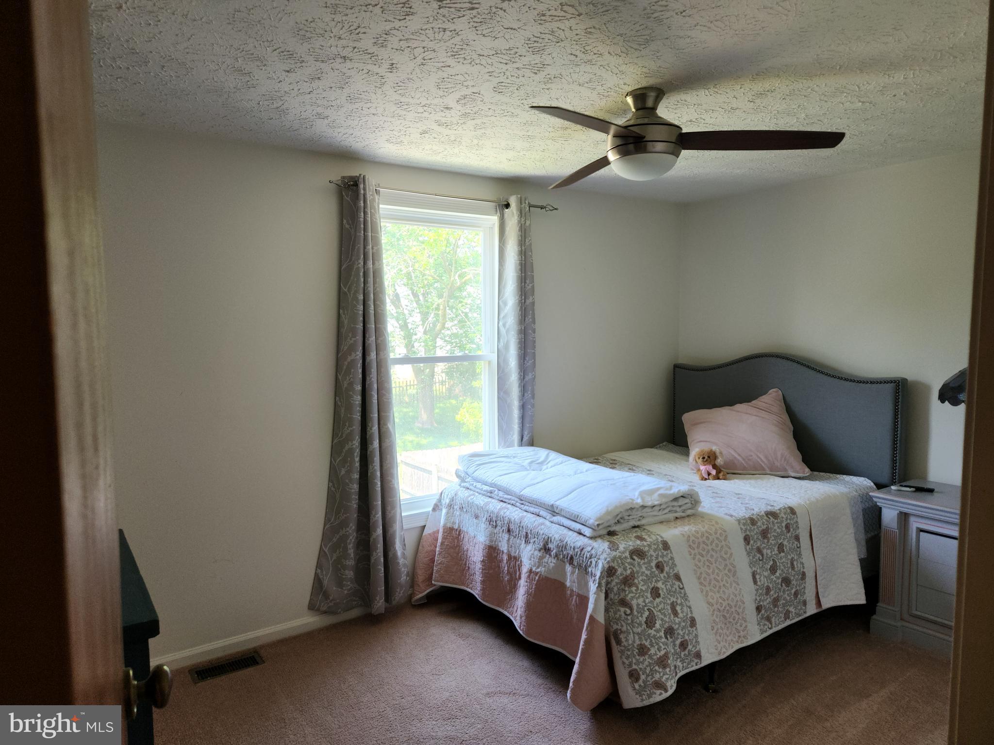 1203 Conewago Drive Frederick, MD 21702 - Photo 14 of 24 a bedroom with a bed and a window
