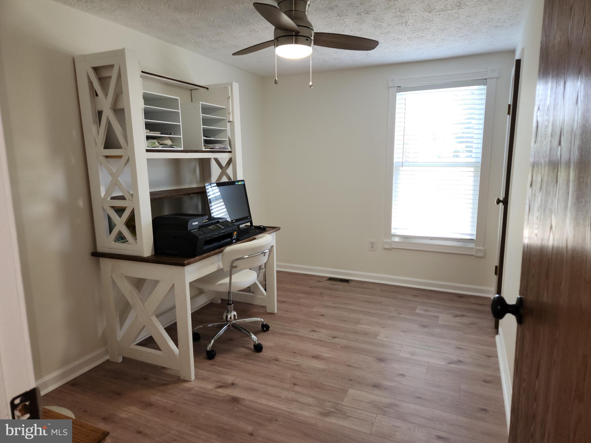 1203 Conewago Drive Frederick, MD 21702 - Photo 15 of 24 a view of a workspace with furniture and a window