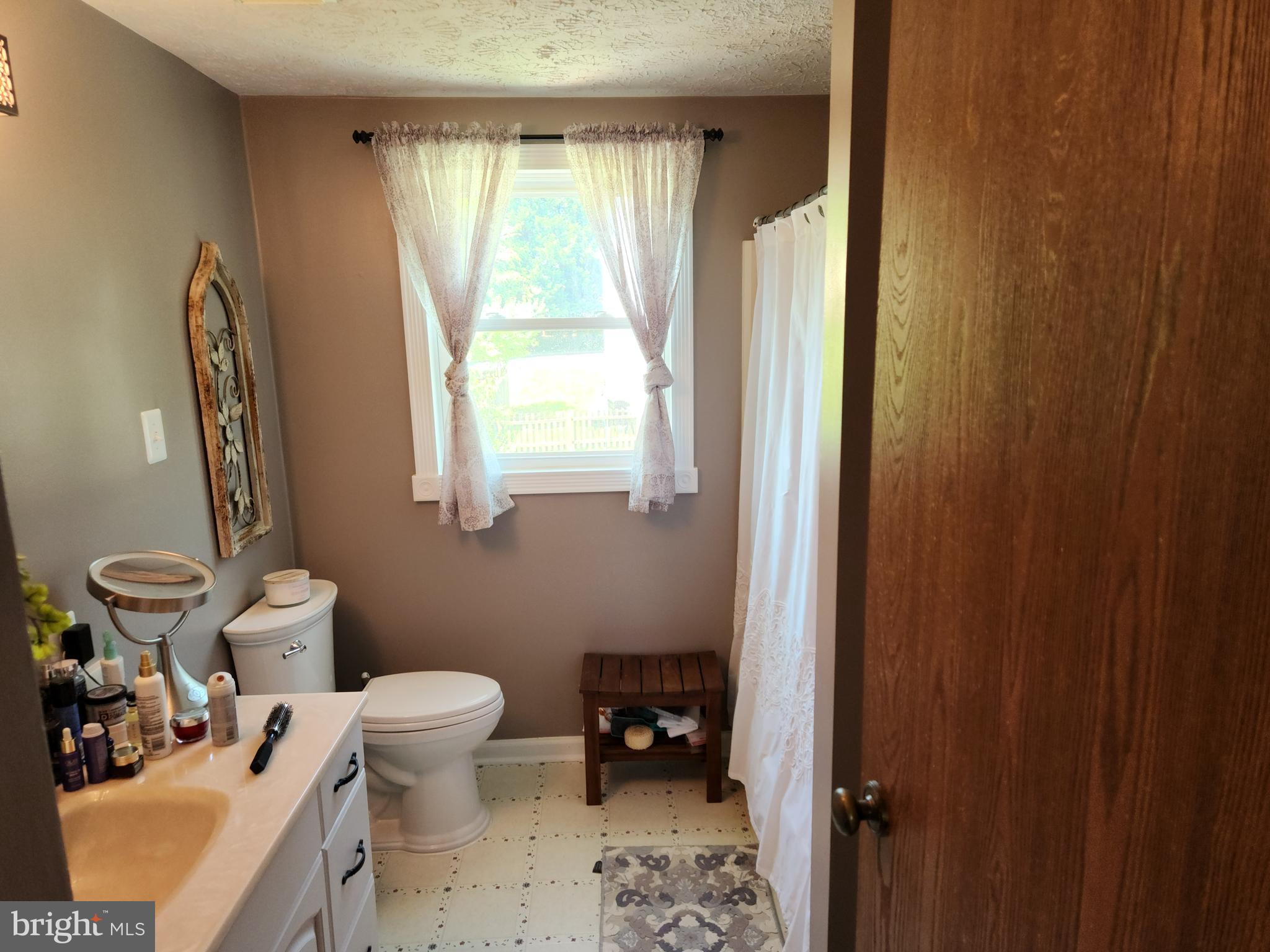 1203 Conewago Drive Frederick, MD 21702 - Photo 18 of 24 a bathroom with a sink toilet and a mirror