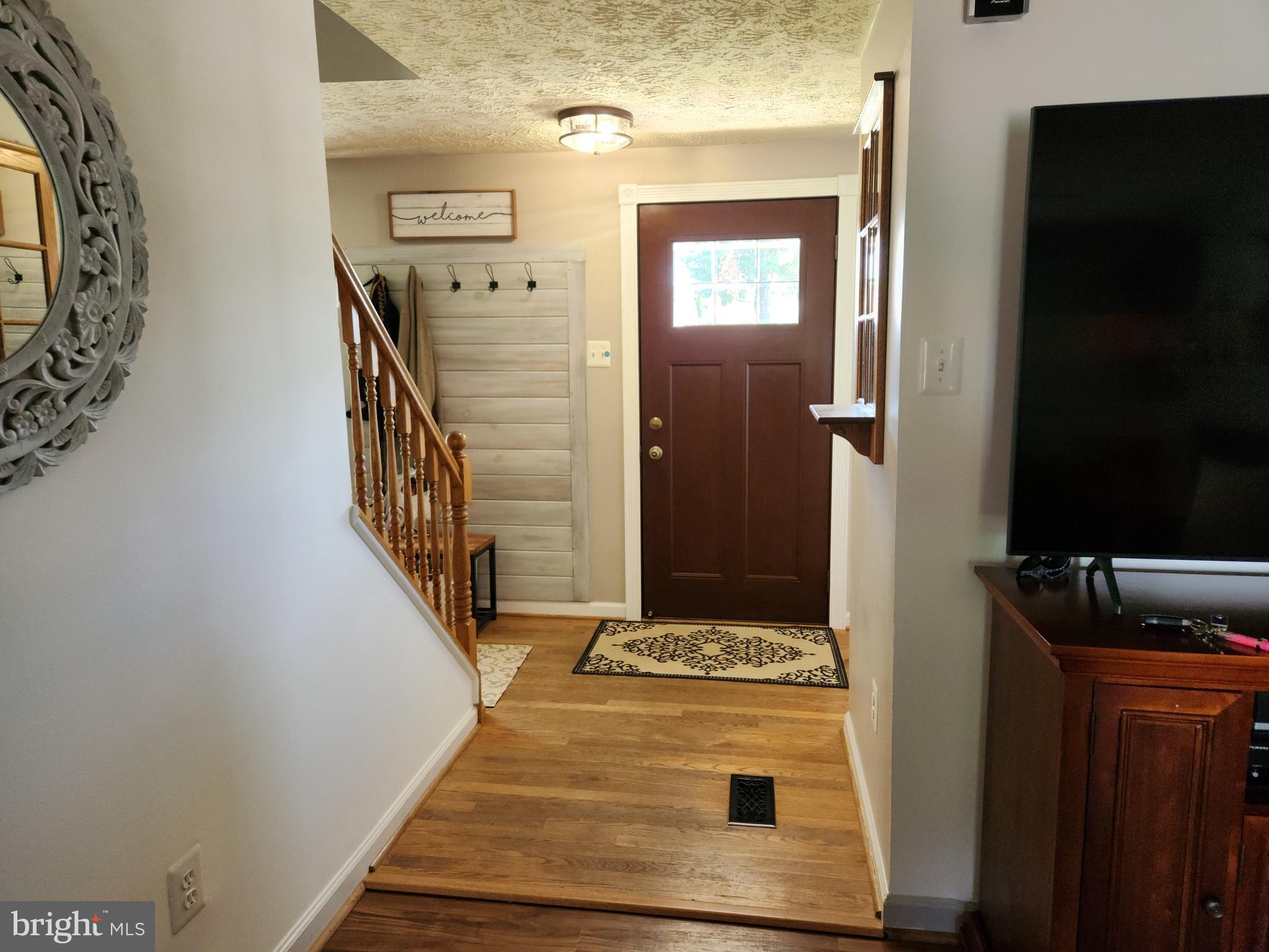 1203 Conewago Drive Frederick, MD 21702 - Photo 2 of 24 a view of a hallway with wooden floor