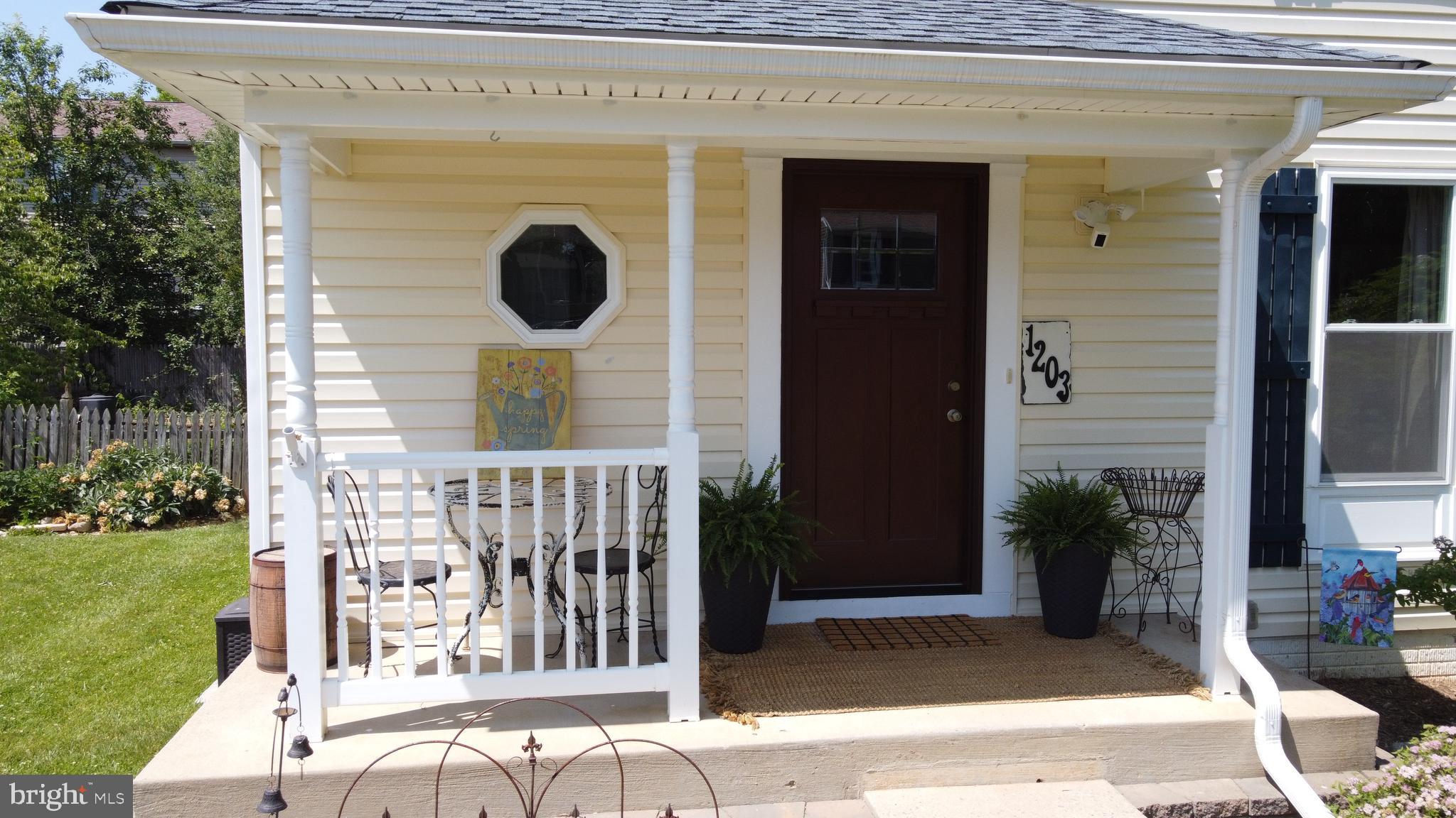 1203 Conewago Drive Frederick, MD 21702 - Photo 21 of 24 a front view of a house with a garden