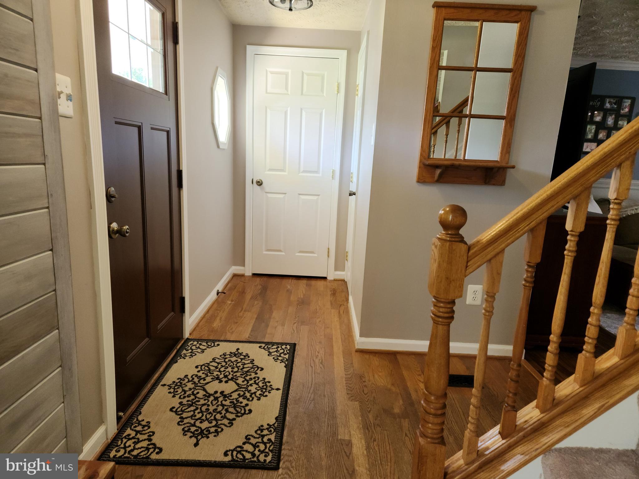 1203 Conewago Drive Frederick, MD 21702 - Photo 3 of 24 a view of entryway with wooden floor and door