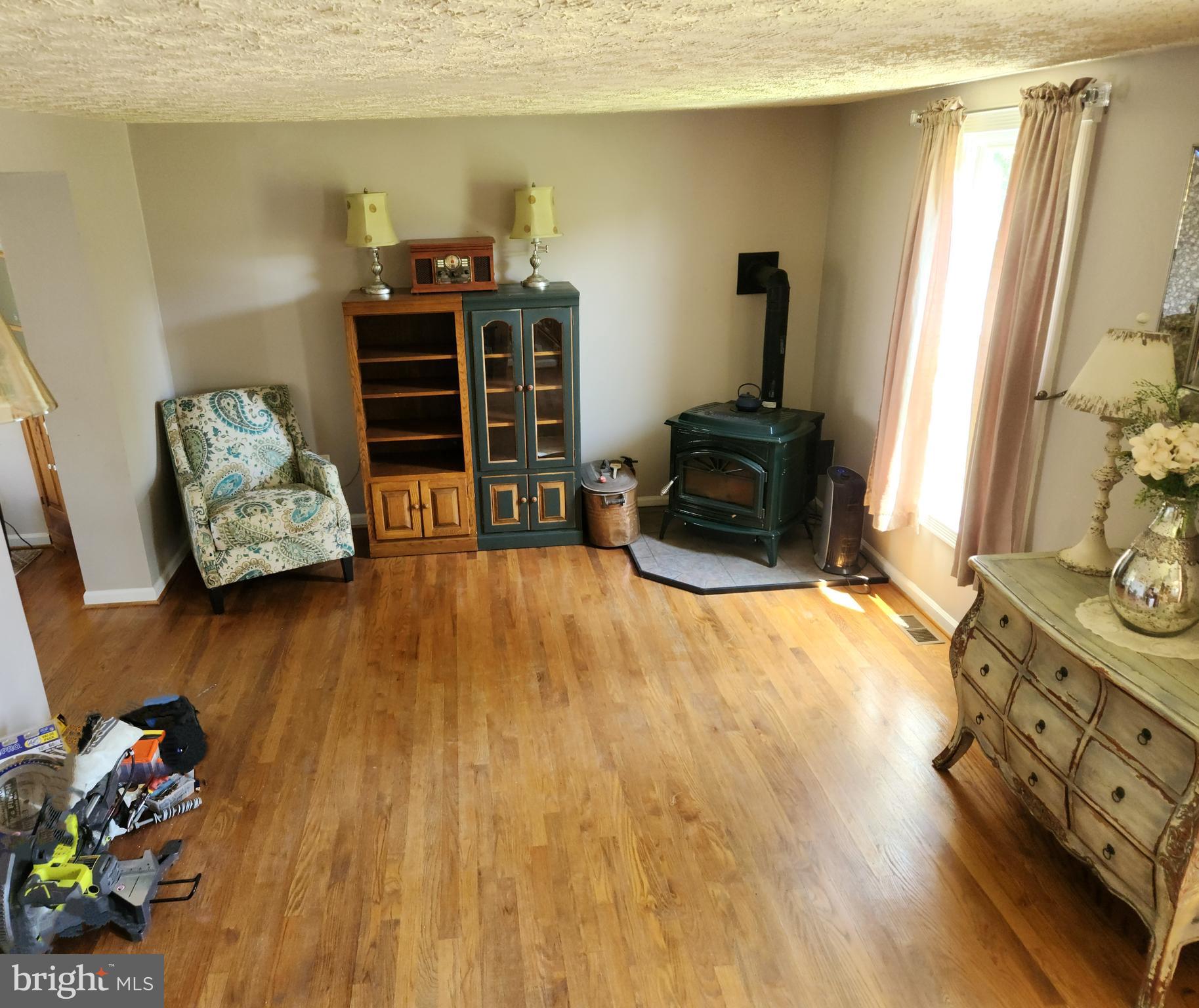 1203 Conewago Drive Frederick, MD 21702 - Photo 8 of 24 a living room with furniture and a wooden floor