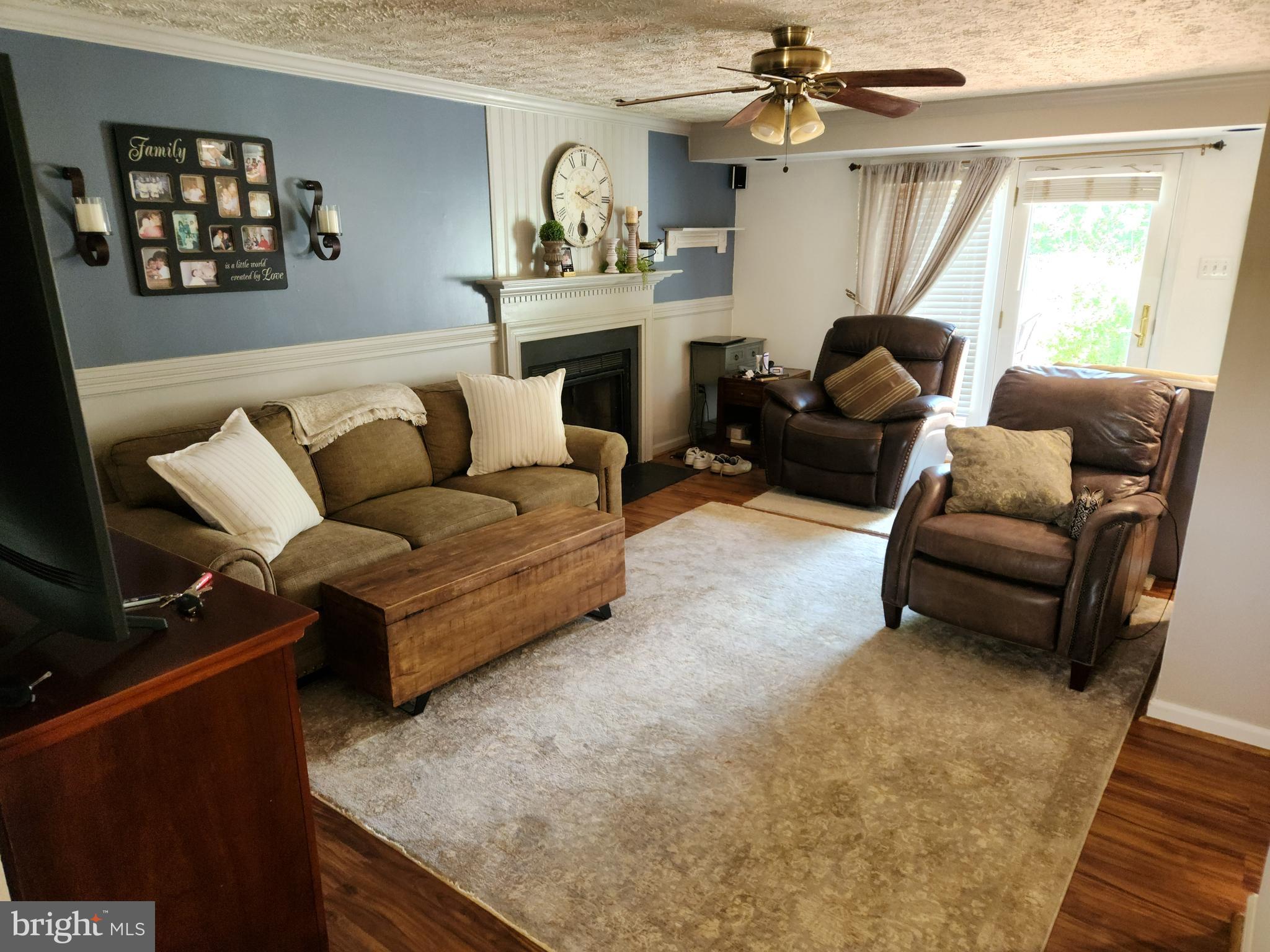 1203 Conewago Drive Frederick, MD 21702 - Photo 9 of 24 a living room with furniture and a fireplace
