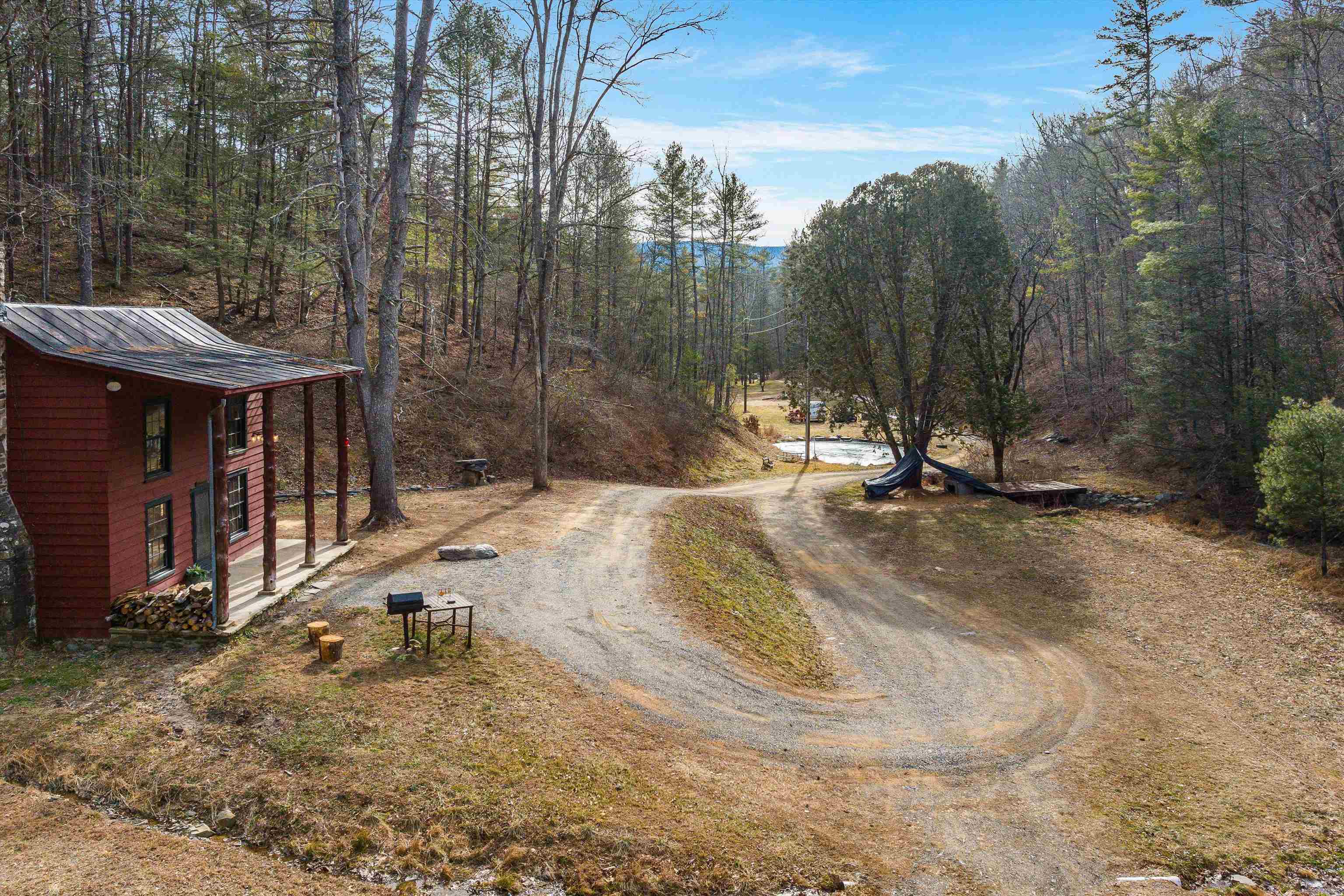 595 Deerfield Valley Road West Augusta, VA 24485 - Photo 18 of 71 a view of a backyard with a small cabin