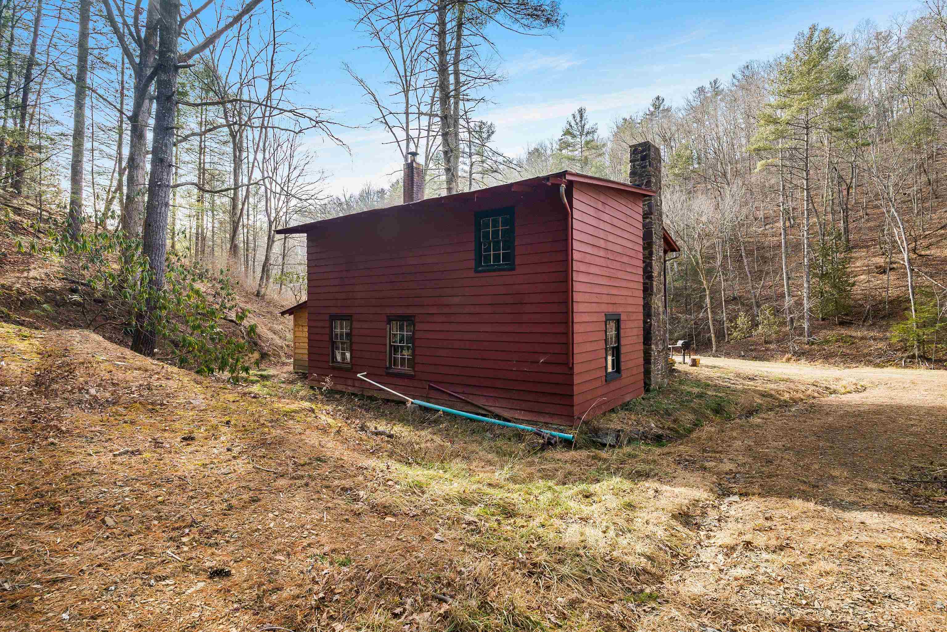 595 Deerfield Valley Road West Augusta, VA 24485 - Photo 60 of 71 a backyard of a house with a large tree and wooden fence