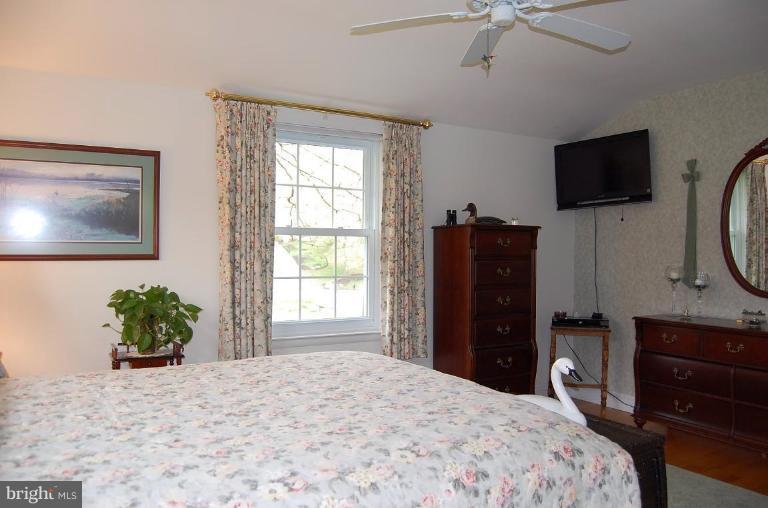 1203 Culvert Road Towson, MD 21286 - Photo 14 of 28 a bedroom with a bed and a flat screen tv