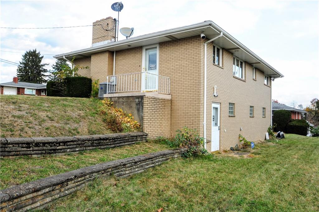 360 Ridge Avenue Monessen, PA 15062 - Photo 32 of 39 a front view of a house with a yard