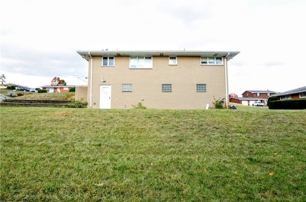 360 Ridge Avenue Monessen, PA 15062 - Photo 34 of 39 a front view of a house with garden