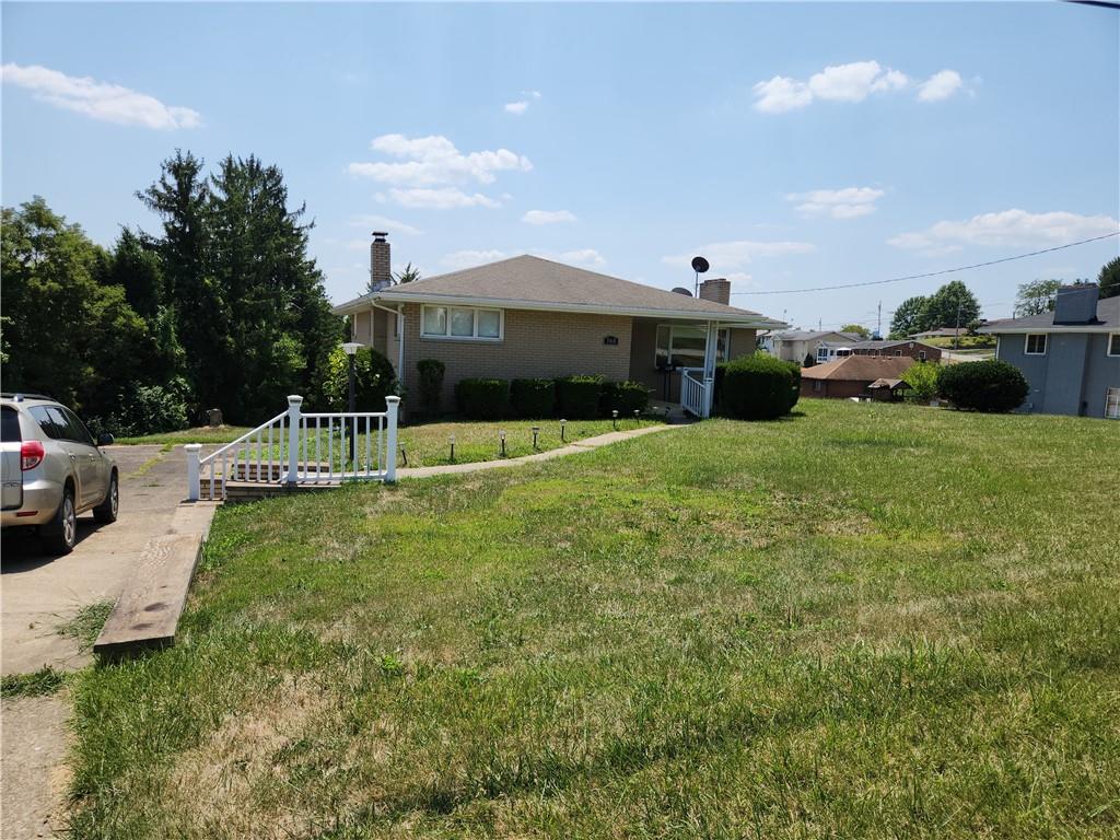 360 Ridge Avenue Monessen, PA 15062 - Photo 37 of 39 a view of a house with a yard and sitting area