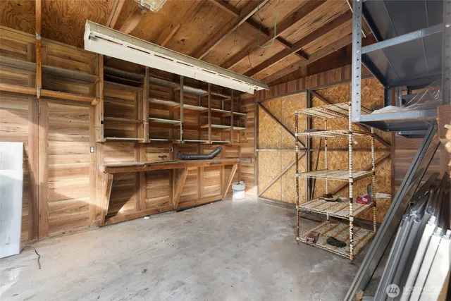 a view of a room with wooden floor and windows