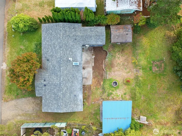 an aerial view of residential house with pool and yard