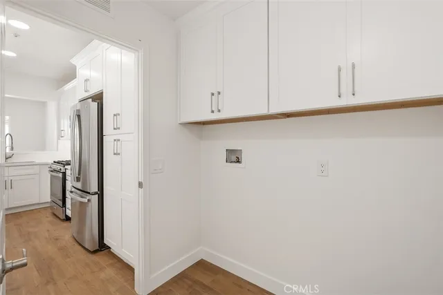 a view of a storage and utility room with closet